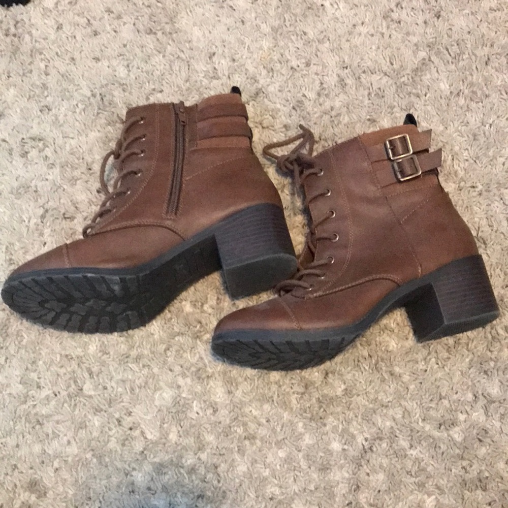Brown high heeled boots with zipper and shoelaces